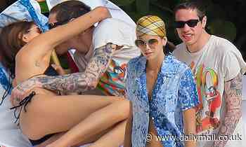 Kaia Gerber strips down to a bikini as she shares a passionate kiss with beau Pete Davidson