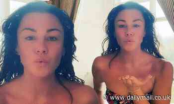 Michelle Heaton, 40, displays her toned figure in a floral swimsuit