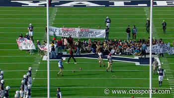 LOOK: Harvard-Yale football game delayed due to on-field protest over climate change