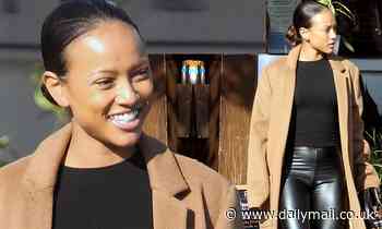 Karrueche Tran is the epitome of fall chic in black leather pants and brown coat while out