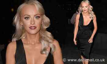 Coronation Street's Katie McGlynn puts on a busty display in a plunging black satin midi dress