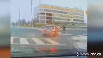 Driver charged after being caught on camera slamming into cyclist in Markham
