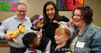 Family takes toddler twins in stride at Hennepin County adoption event