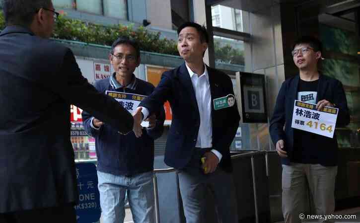 Champagne flows as landslide democratic win puts pressure on Hong Kong leader