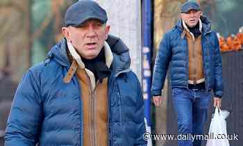 James Bond star Daniel Craig protects himself against the winter chill
