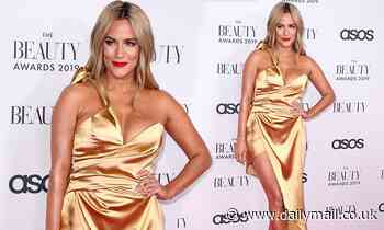 Caroline Flack steps out in a busty satin dress at the 2019 Beauty Awards