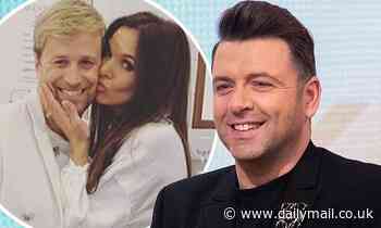 Westlife's Kian Egan jokes wife Jodie is 'broody' after babysitting Mark Feehily's baby daughter