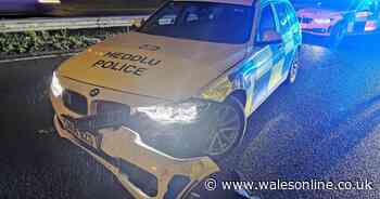 Police officer hurt when they blocked off closed road with patrol car and someone crashed into it