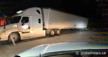 Semi dragging trailer missing 6 of 8 wheels pulled over near Saskatoon