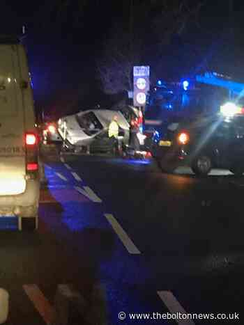 Car overturns in crash on Lostock bridge