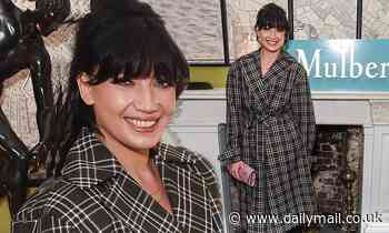 Daisy Lowe rocks a checked olive green belted mac at Mulberry bash