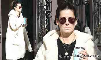 Sandra Bullock looks ready for a winter storm in her long coat