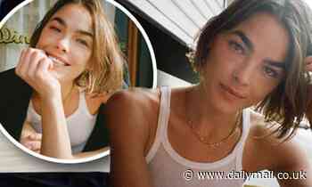 Bambi Northwood-Blyth poses braless in a white singlet top as she poses at a cafe in Manhattan 