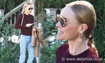 Kate Bosworth cuts a casual figure in cable knit sweater and distressed jeans