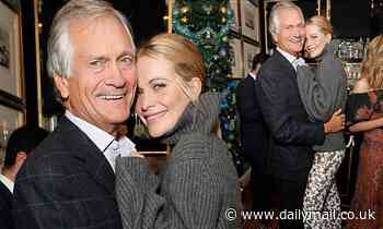 Poppy Delevingne stuns in a large grey turtle-neck jumper as she cosies up to her father Charles