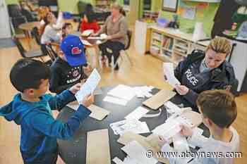 White Rock kids stick anti-impaired driving messages to 3,000 liquor store bags