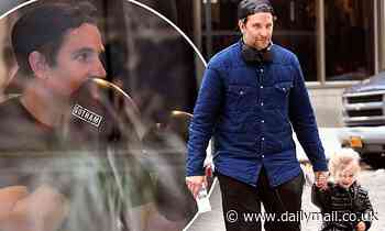 Bradley Cooper is seen with his daughter Lea, two, before enduring an intense boxing session