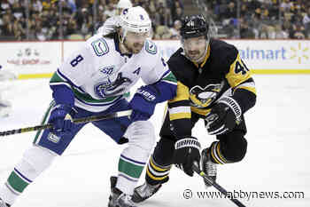 Penguins rally for wild 8-6 triumph over Canucks