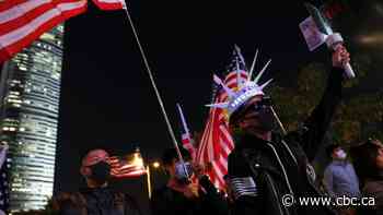 China warns U.S. over Hong Kong law as thousands stage 'Thanksgiving' rally
