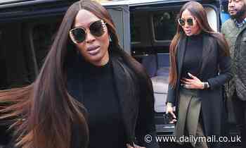 Naomi Campbell cuts a stylish figure in a chic fitted coat as she steps out in London