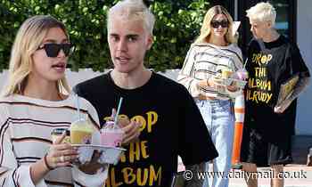 Justin Bieber swaps his pink hair for platinum blonde as he and Hailey continue their Miami holiday
