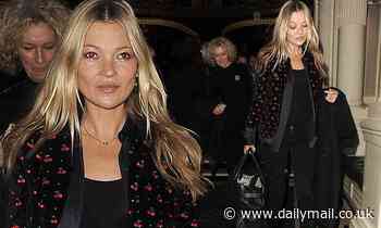 Kate Moss cuts a typically chic figure in a cherry-print jacket steps out of London hotel