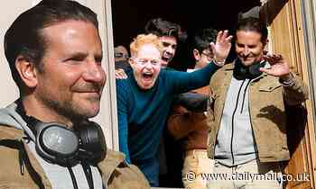 Bradley Cooper enjoys front row window seats to NYC's Thanksgiving Parade with Jesse Tyler Ferguson