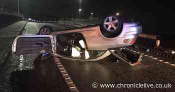 Unconscious driver cut free from flipped car by firefighters after crash on Redheugh Bridge