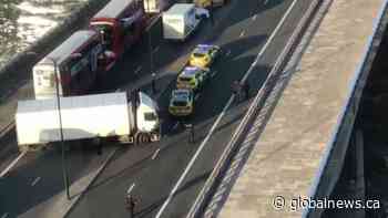 Police advance across London Bridge with weapons drawn following reported stabbing