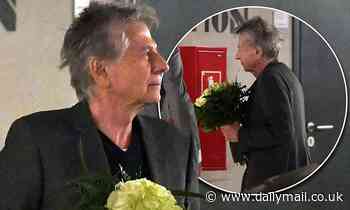 Director Roman Polanski, 86, steps out with white roses in Poland after new sexual assault claims