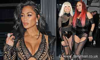 X Factor's Nicole Scherzinger shows off her taut abs in a black cut-out dress