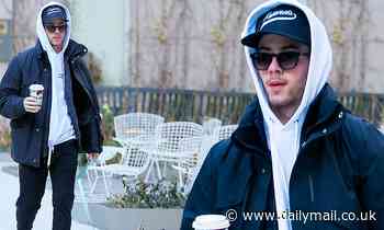 Nick Jonas bonds with Priyanka Chopra's dog Diana before taking his new puppy Gino out for a stroll