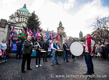 Loyalists march on Belfast City Hall for Union flag protests anniversary