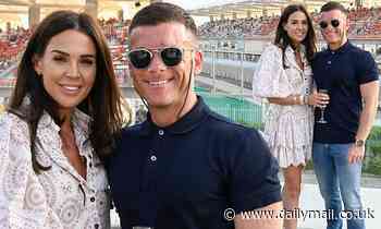 Danielle Lloyd cosies up to husband Michael O'Neill at the Abu Dhabi Grand Prix 