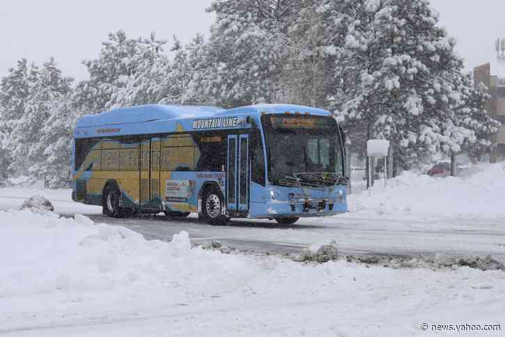 The Latest: Chicago, Denver flights delayed by winter storm