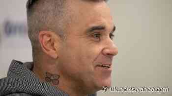 Robbie Williams stokes Liam Gallagher feud with chicken imitation