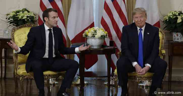 Trump barrels into NATO summit, clashes with France’s Macron
