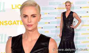Charlize Theron turns heads in a skintight leather midi dress at Bombshell premiere