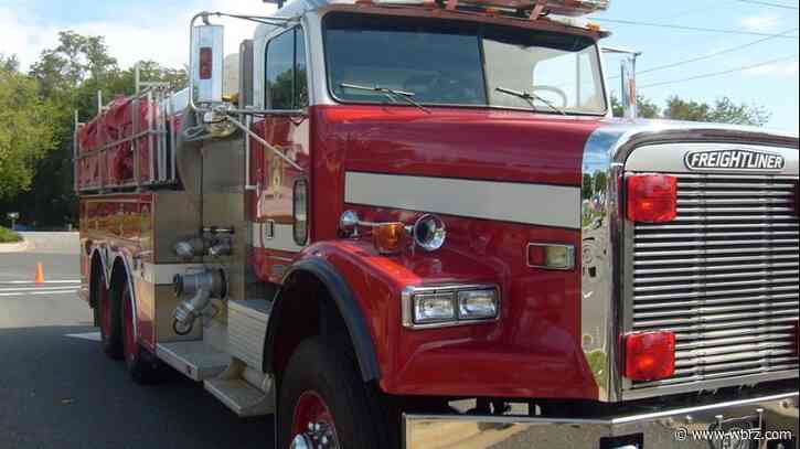 Parked truck catches fire, flames spread to home