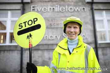 Northern Ireland lollipop lady honoured for keeping pupils safe for 40 years