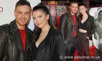 Liam Payne looks delighted as he poses with ab-flashing girlfriend Maya Henry
