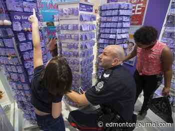 Watch: Cops help kids with Christmas wish lists