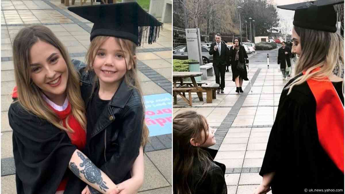 Mother who gave birth as teenager graduates holding daughter’s hand