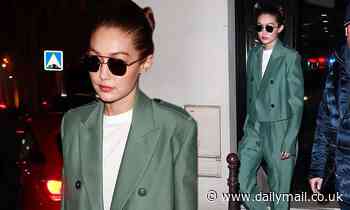 Gigi Hadid turns heads in a metallic green power suit as she leaves Chanel HQ in Paris