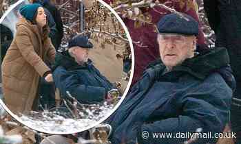 Michael Caine is pushed in a wheelchair by Aubrey Plaza during filming for comedy Best Sellers