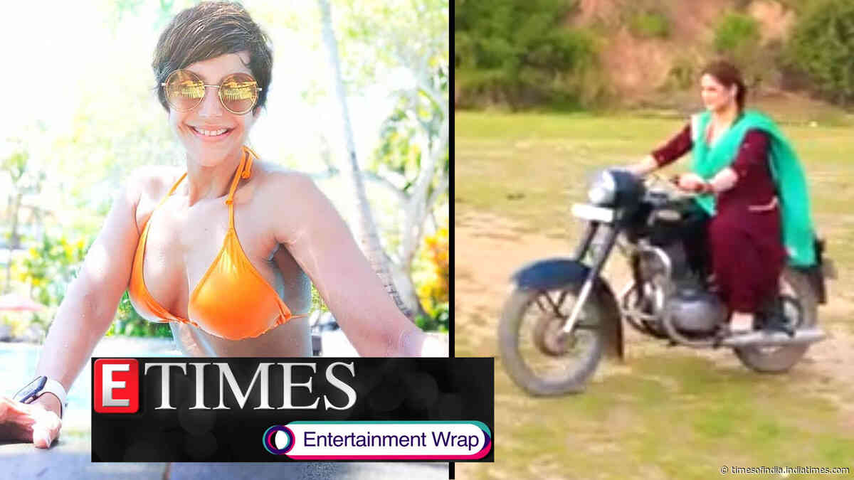 Mandira Bedi flaunts incredibly toned figure in orange bikini; Zareen Khan rides motorcycle like a pro, and more…