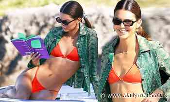 Kendall Jenner wears bikini and reads book on Miami yacht