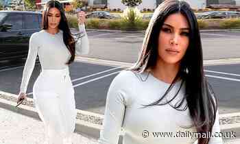 Kim Kardashian highlights her slim waist in bodysuit with high-waisted trousers while stepping out