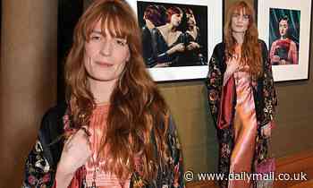 Florence Welch oozes boho chic in a pink satin dress at National Portrait Gallery