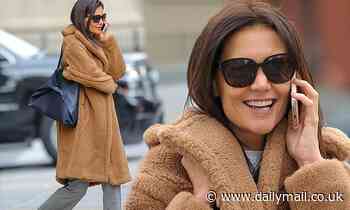 Katie Holmes bundles up warm in a faux fur coat and checked trousers during chilly NYC outing